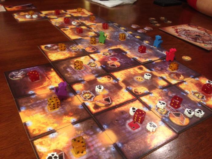 The little skeleton heads are deckhands. Lucky Kickstarter backers received the cool little skulls. It appears mortals will receive white cubes in their boxes, instead.